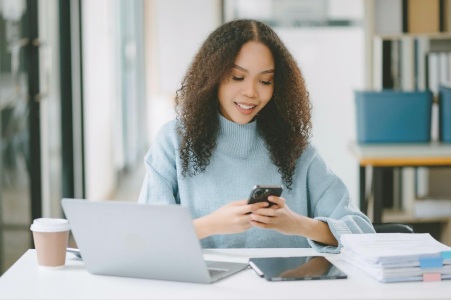 Person confidently reviewing financial documents at organized workspace